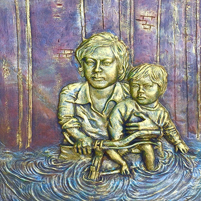 Mother carrying her child